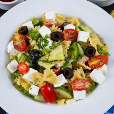 Close-up of Greek pasta salad with crumbled feta and kalamata olives