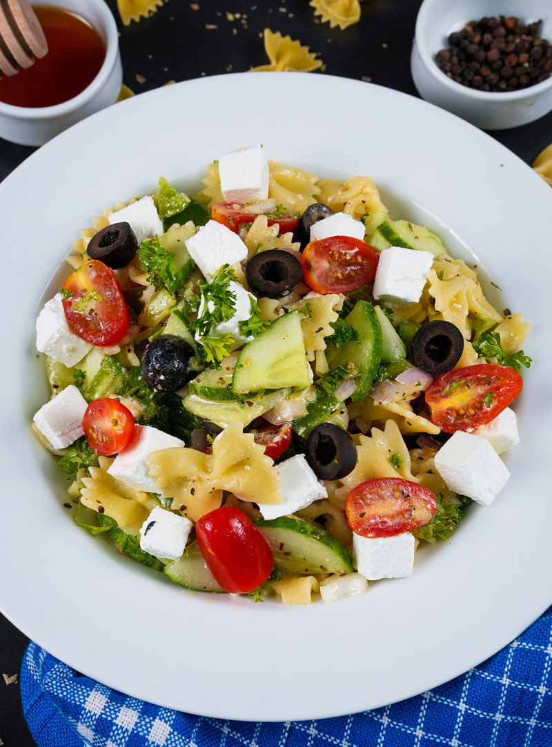 Close-up of Greek pasta salad with crumbled feta and kalamata olives