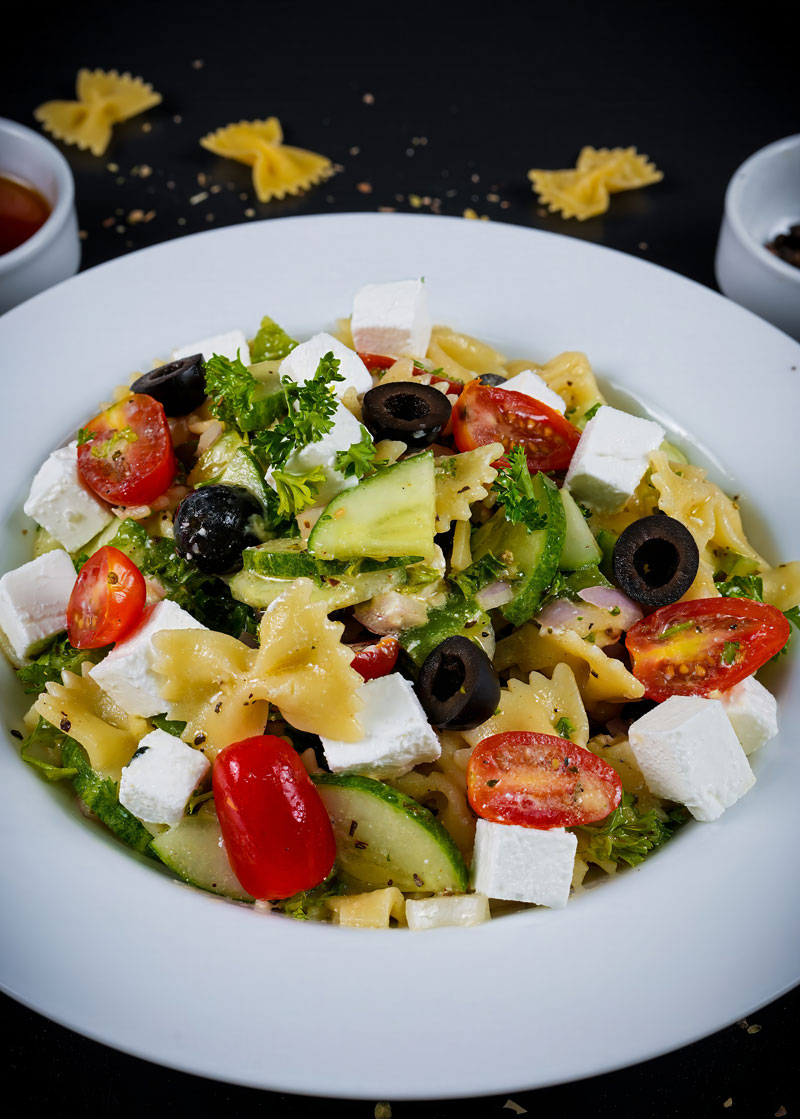 Mediterranean farfalle pasta salad with fresh herbs and honey dressing