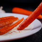 Roasted carrot dipped in creamy yogurt sauce.