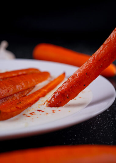 Roasted carrot dipped in creamy yogurt sauce.