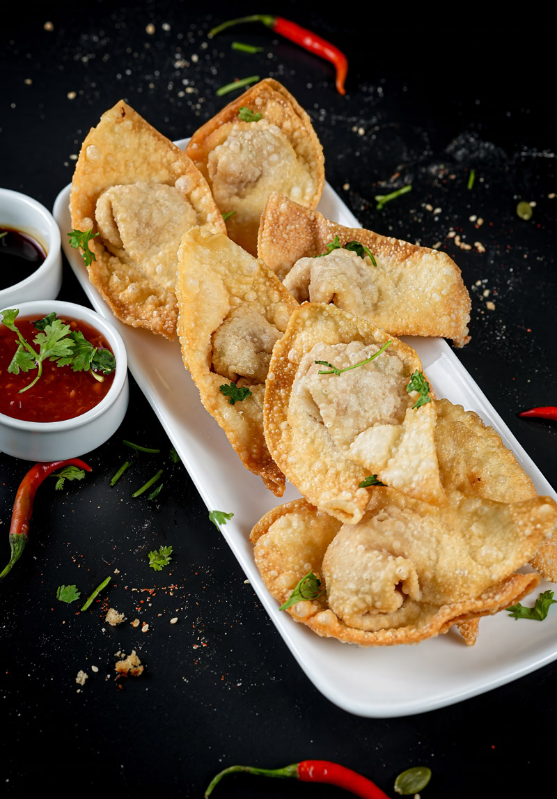 Golden fried wontons served with soy and chili sauce.