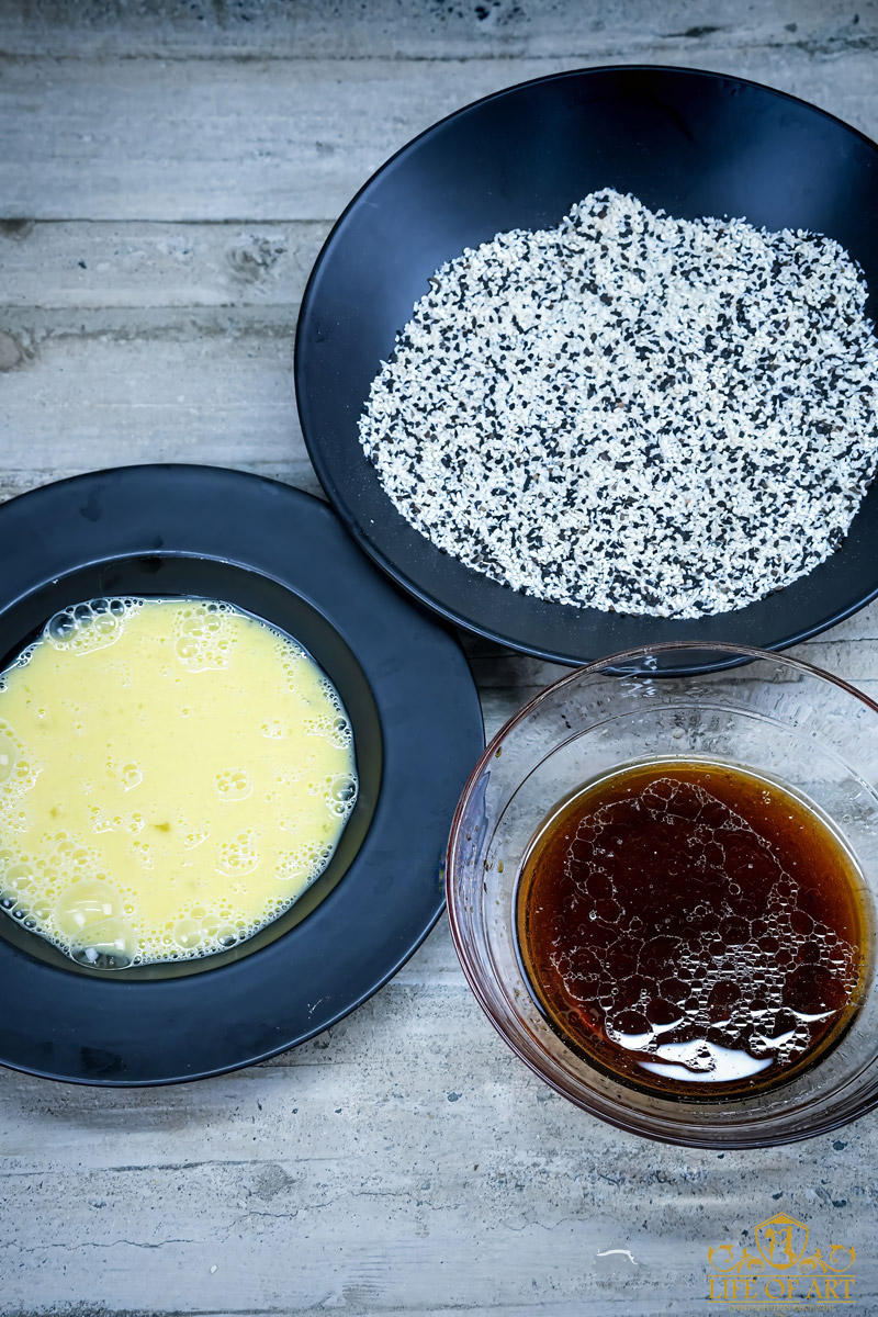 Coating Sesame Tofu in Egg and Sesame Seeds