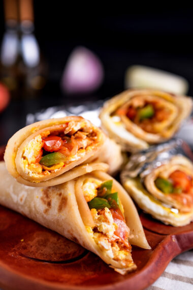 Fresh breakfast wrap with eggs, diced tomatoes and green peppers