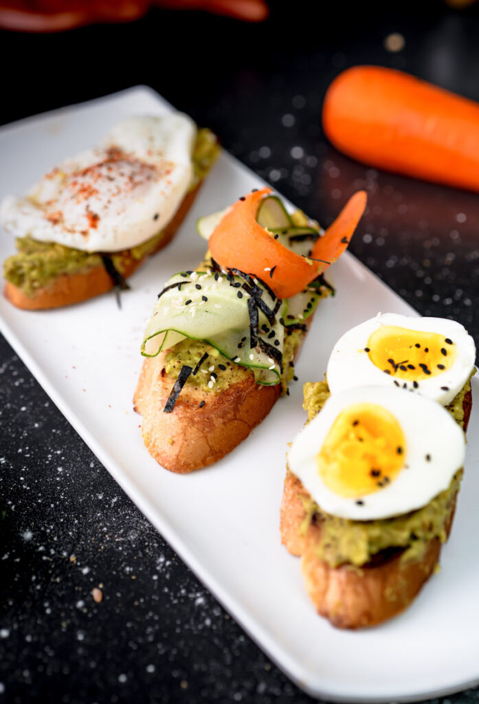Avocado toast platter with Japanese-inspired cucumber and seaweed toppings"