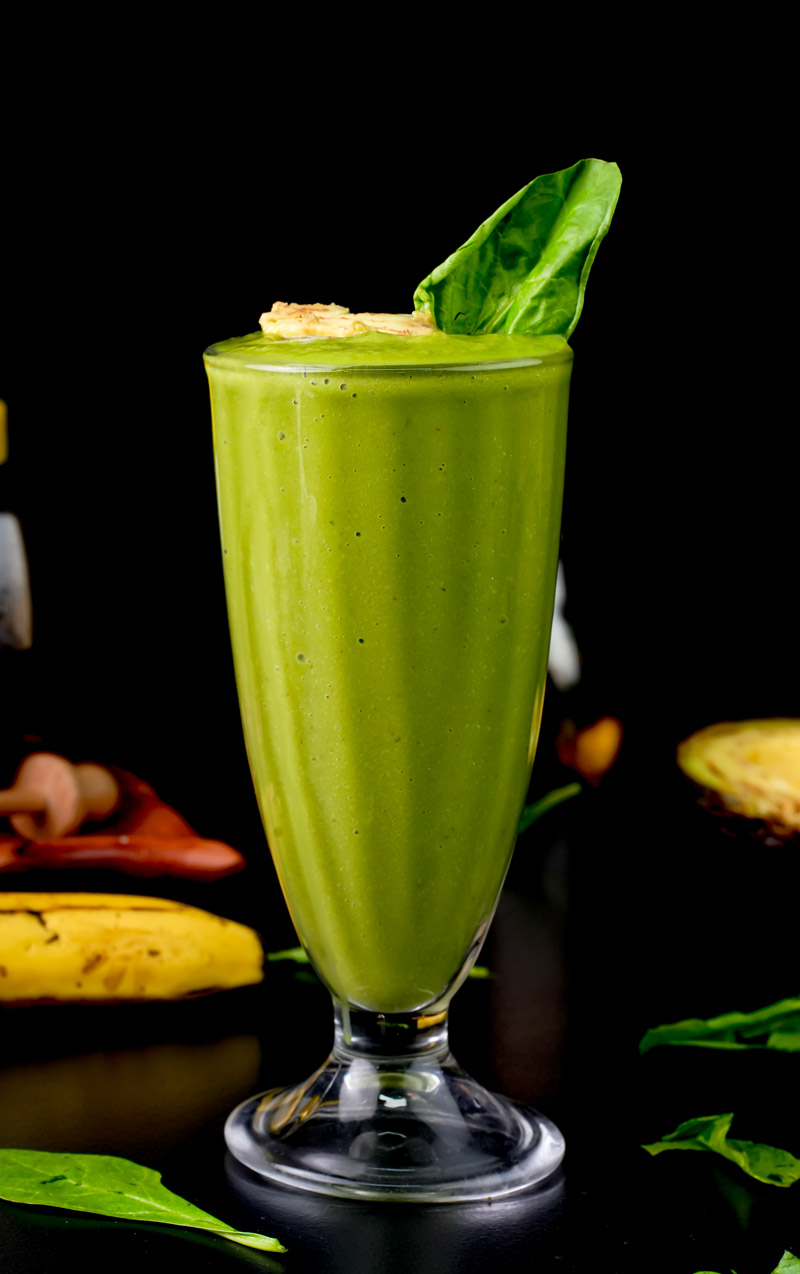Healthy avocado spinach banana smoothie in parfait glass