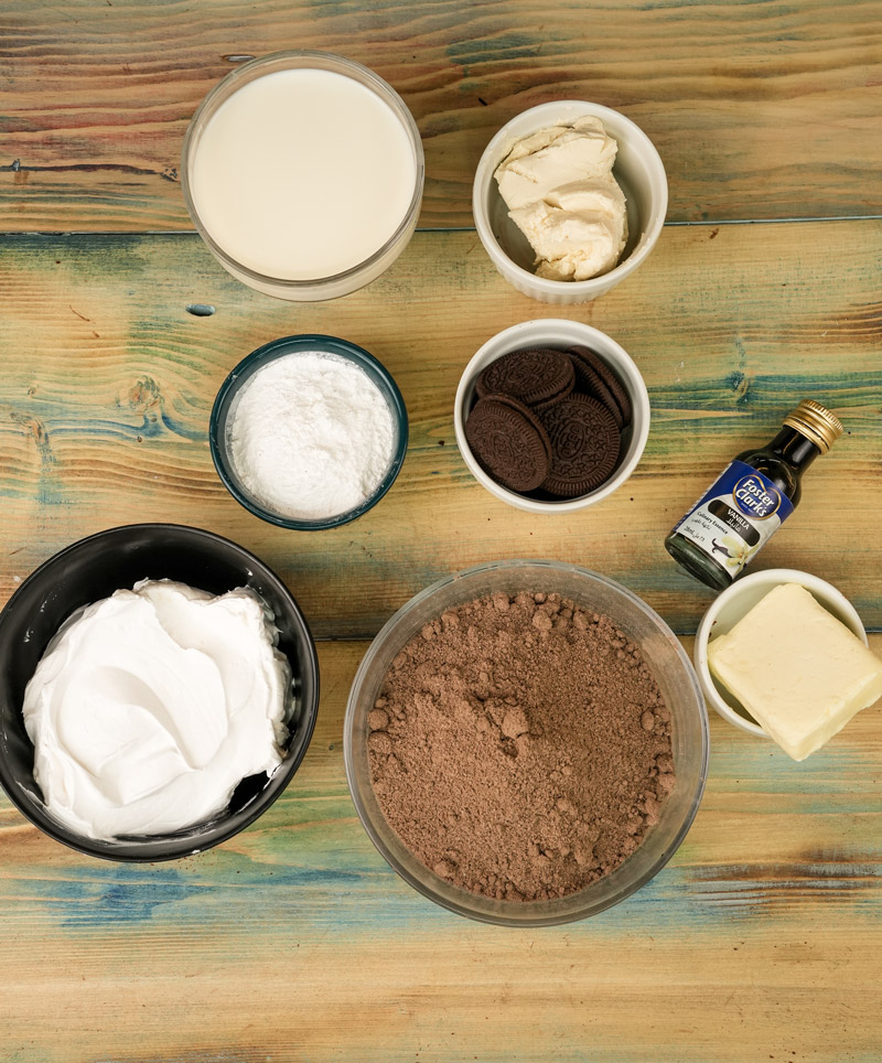 Ingredients for Oreo dirt cake including cookies, cream, and butter