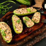 Low carb tuna cucumber boats with fresh cilantro garnish