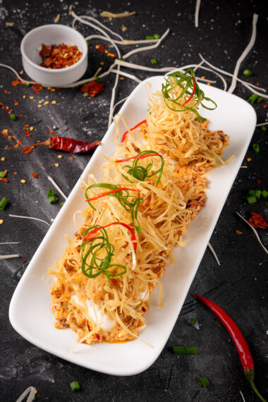 Artfully presented mala cream shrimp dimsum with garnishes