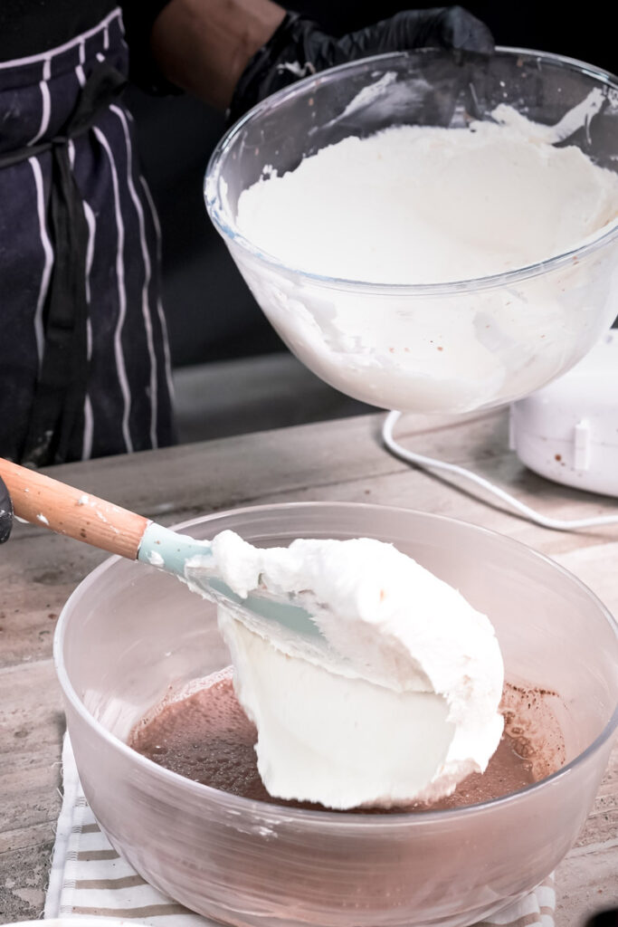 Mixing cream filling for homemade Oreo dirt cake