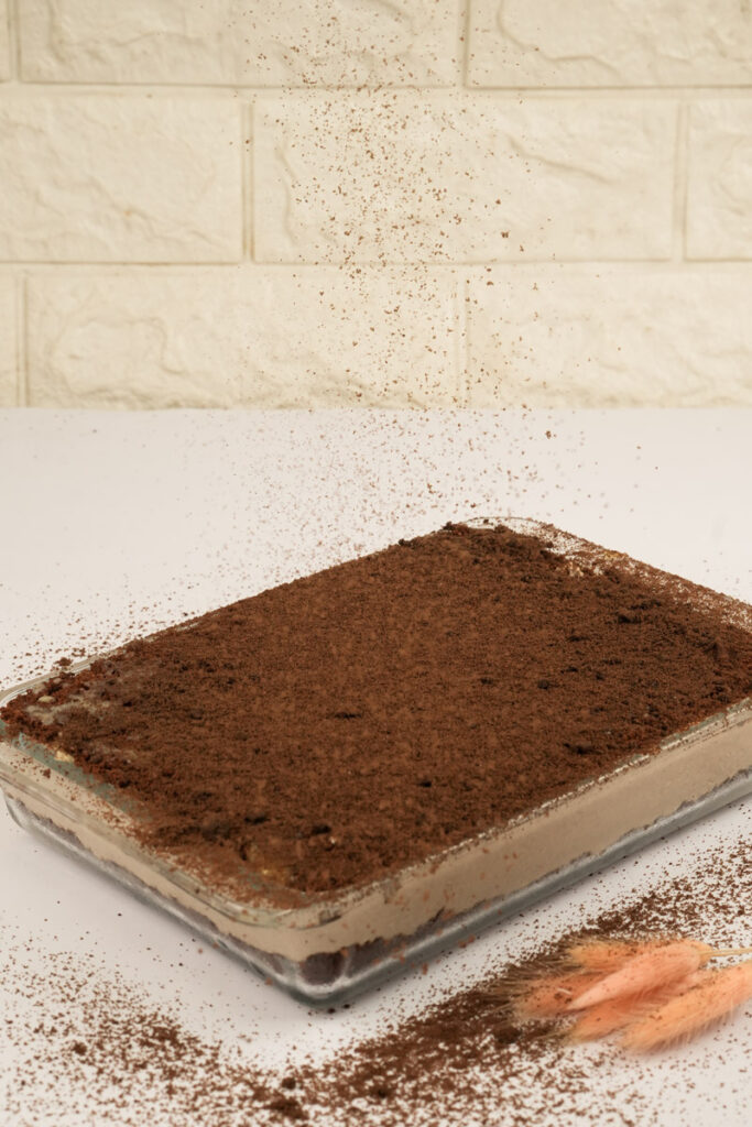 Oreo dirt cake with chocolate crumbs sprinkled on top