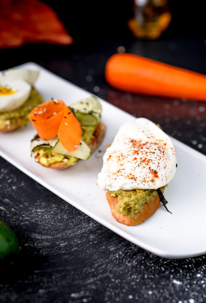 Elegant avocado toast sampler with poached and boiled egg variations
