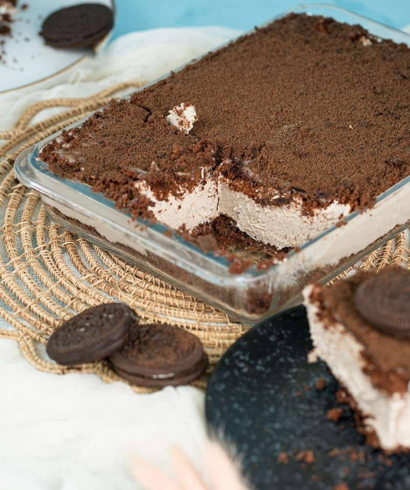 Close-up of Oreo dirt cake with creamy filling and chocolate topping
