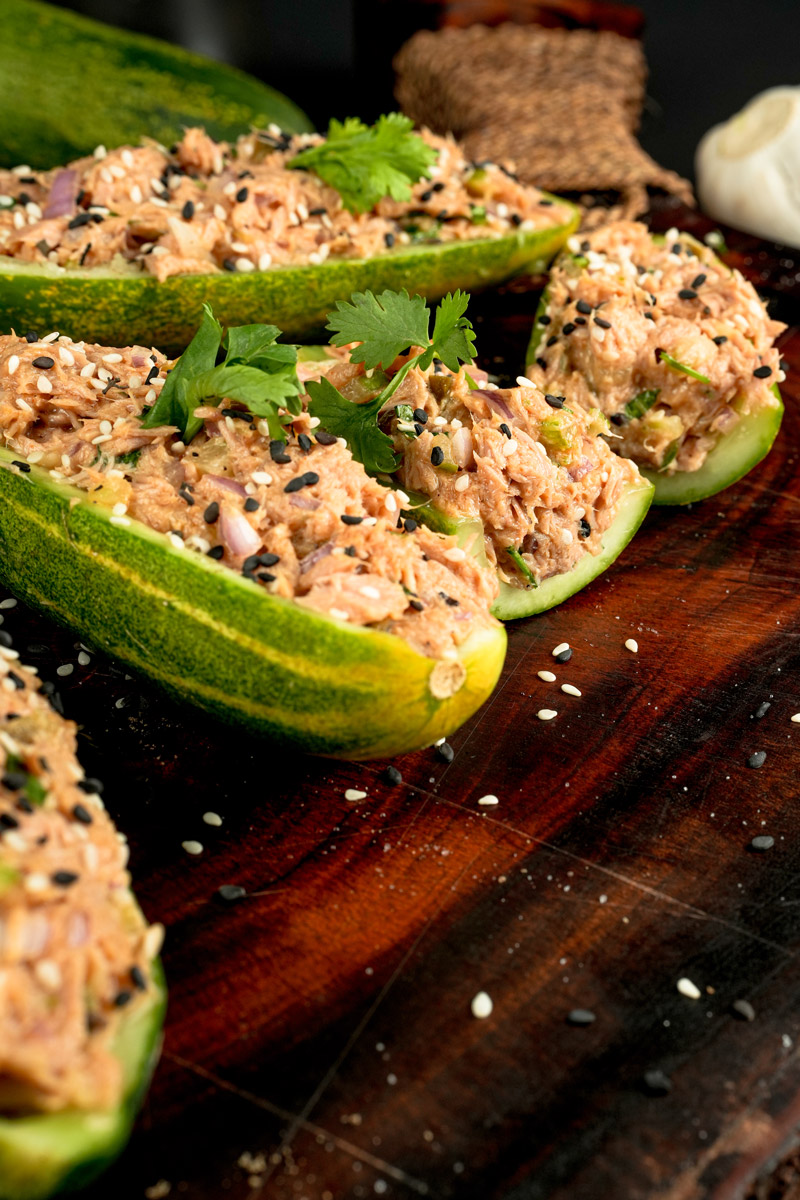 Close-up of tuna salad cucumber boats with black and white sesame seeds