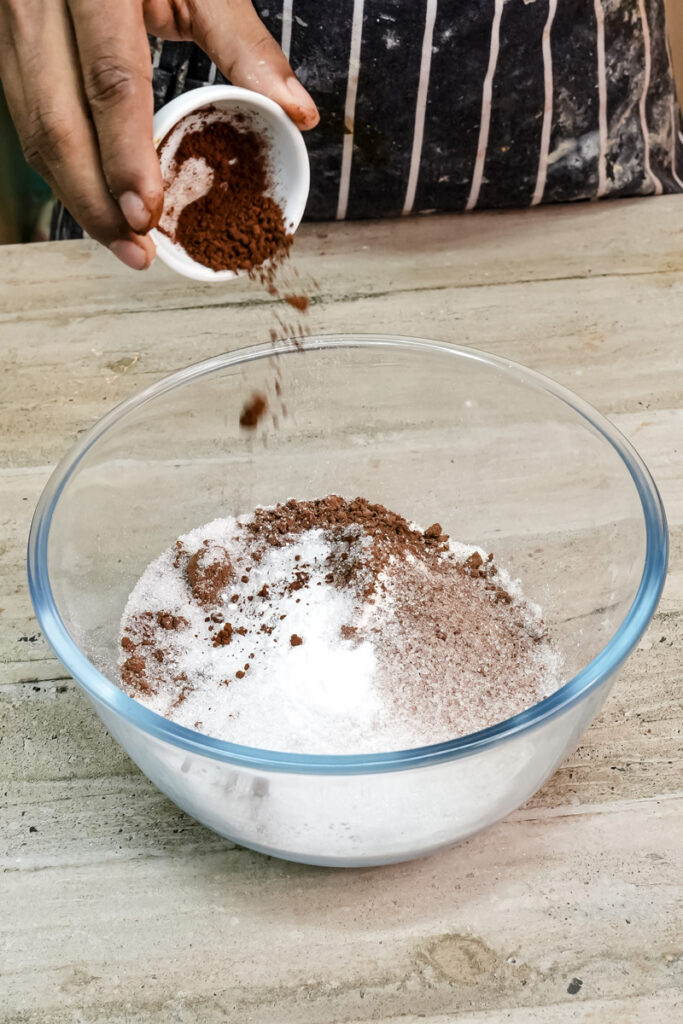 Adding cocoa powder to dry ingredients for Ferrero Rocher cake batter