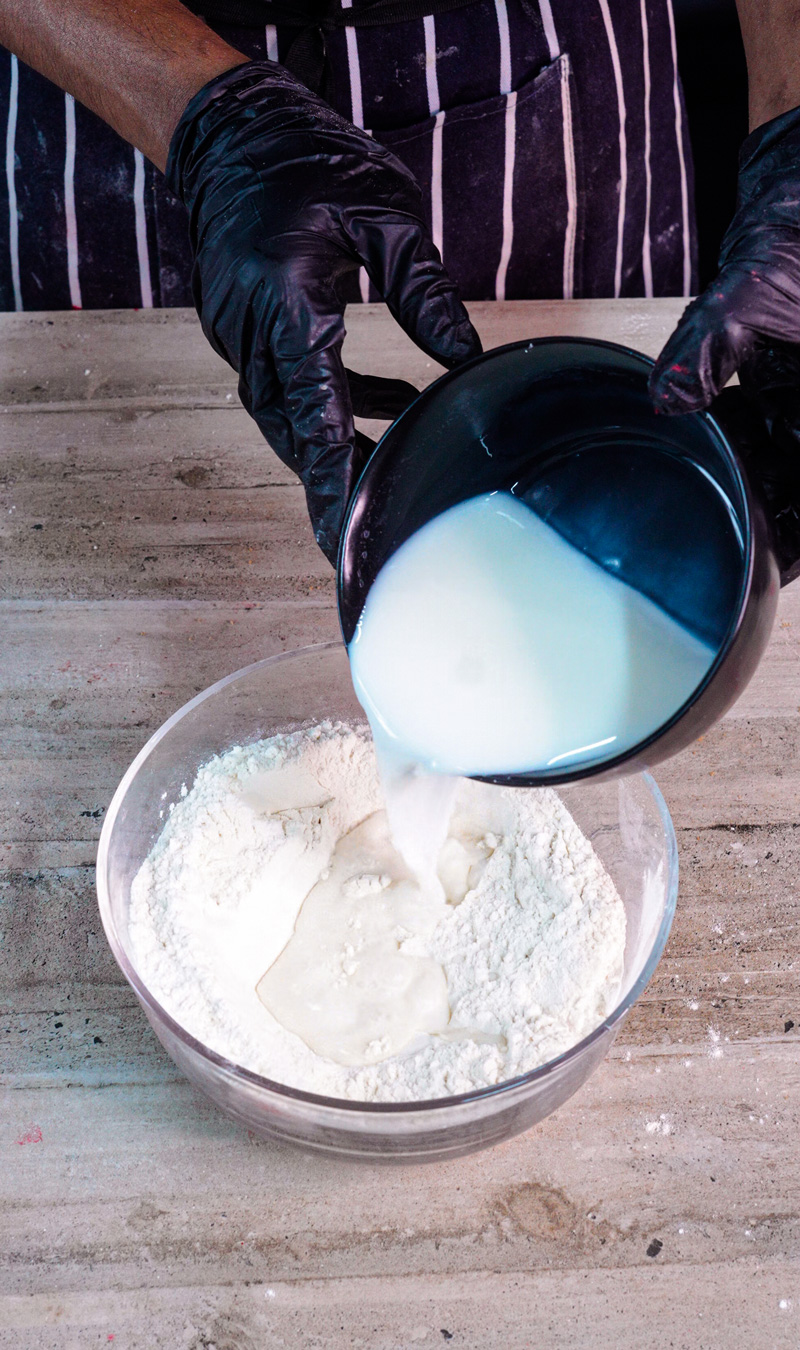 Adding milk to gluten free flour mixture for pancake batter