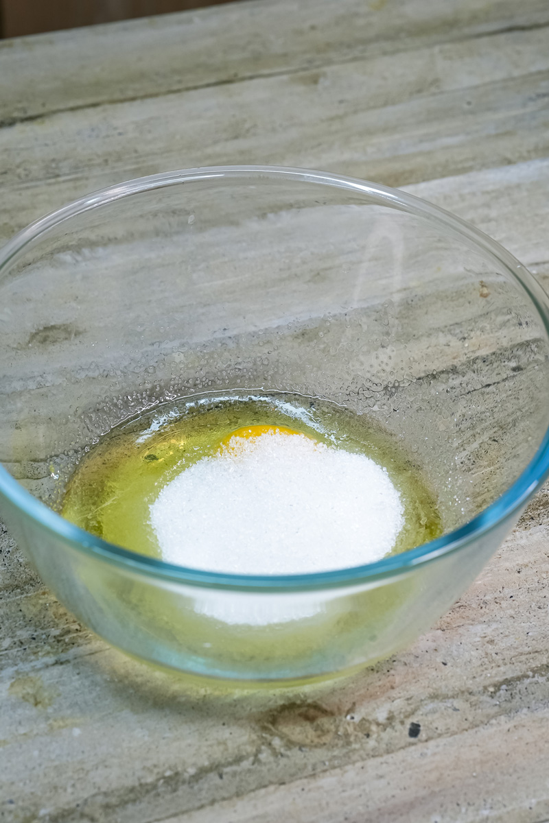 Adding sugar to wet ingredients for mango muffins
