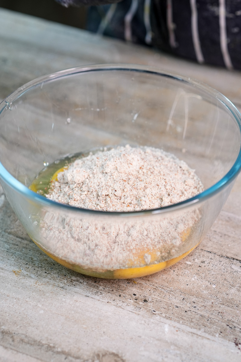 Almond flour mixed with eggs for opera cake sponge preparation