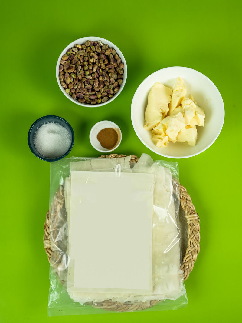 Baklava ingredients: pistachios, phyllo dough, butter, sugar