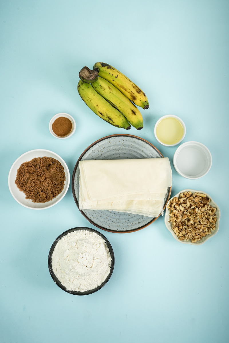 Banana lumpia ingredients - bananas, wrappers, sugar, nuts, coconut