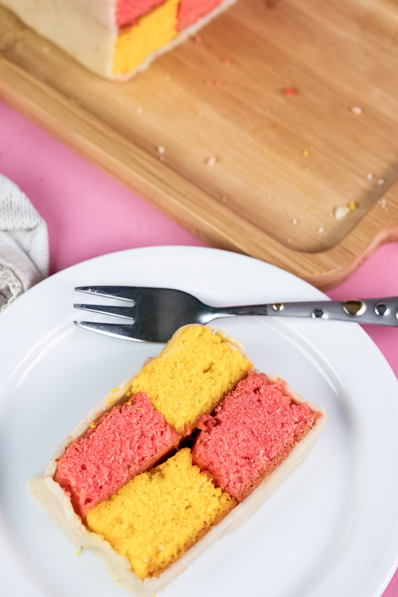 Battenberg cake portions on cutting board showing internal structure