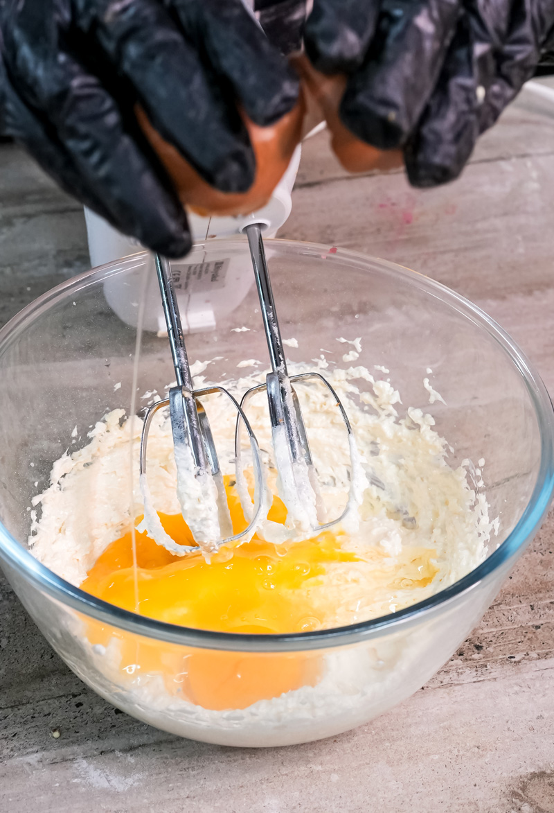 Beating eggs with electric mixer for Madeira cake batter