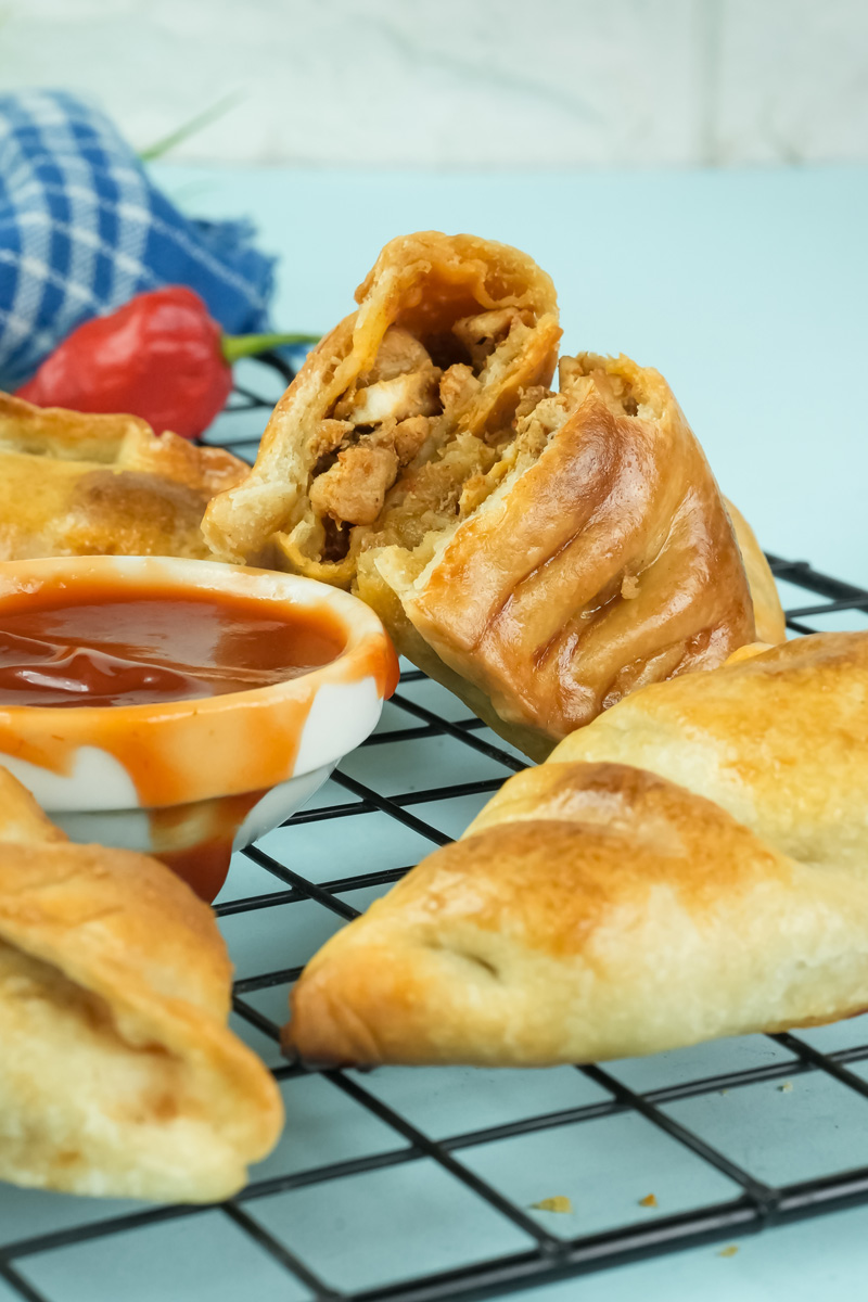 Chicken empanada cross-section revealing savory filling