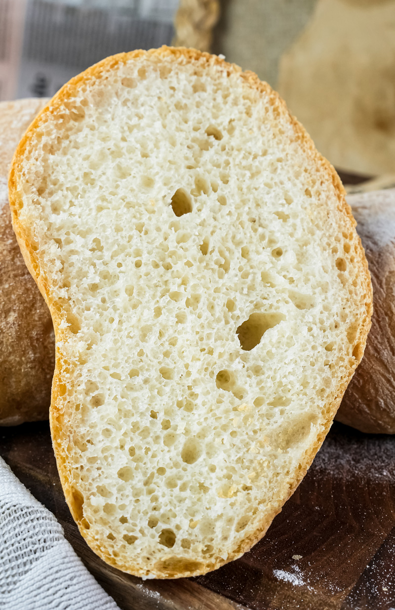 Ciabatta bread slice with characteristic holes and texture