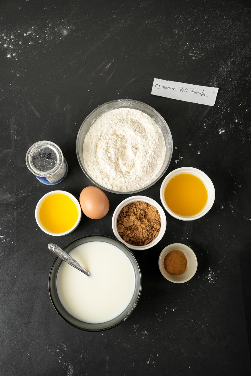 Cinnamon roll pancake recipe ingredients with flour, eggs, milk and spices