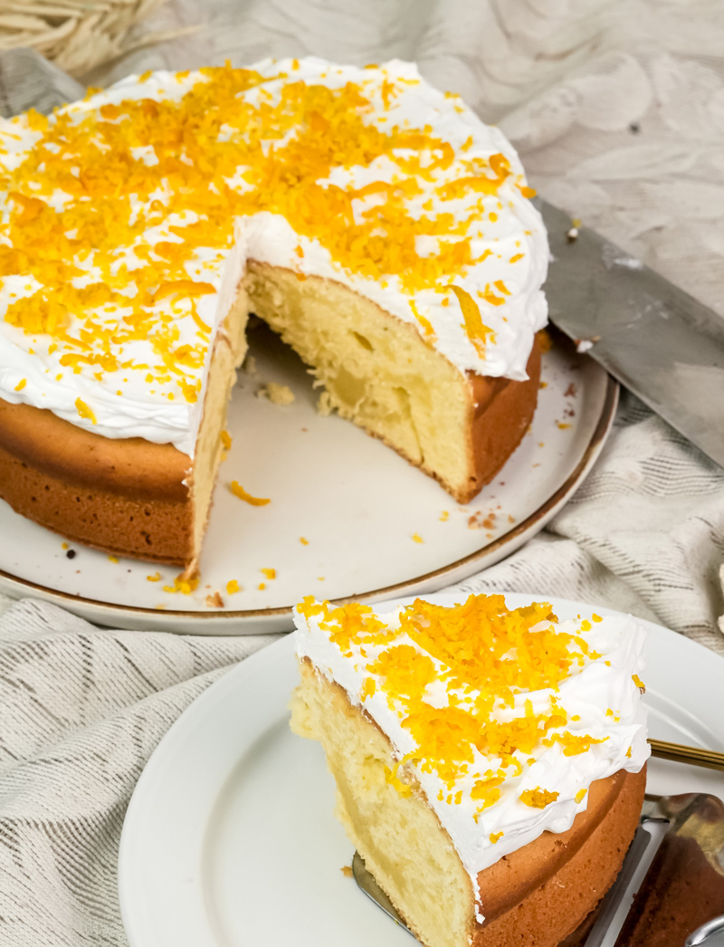 Citrus cake slice with bite taken showing tender crumb structure