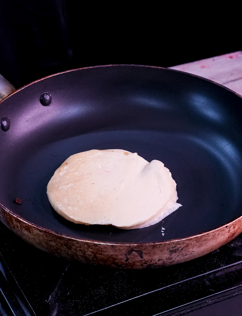 Close-up of gluten free pancake batter being poured into pan