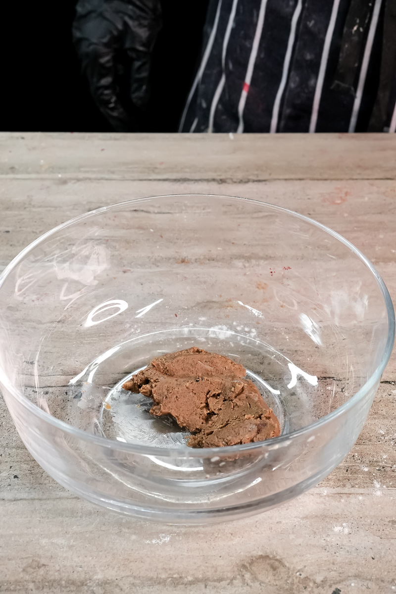 Cocoa powder in glass mixing bowl for peanut butter pancakes