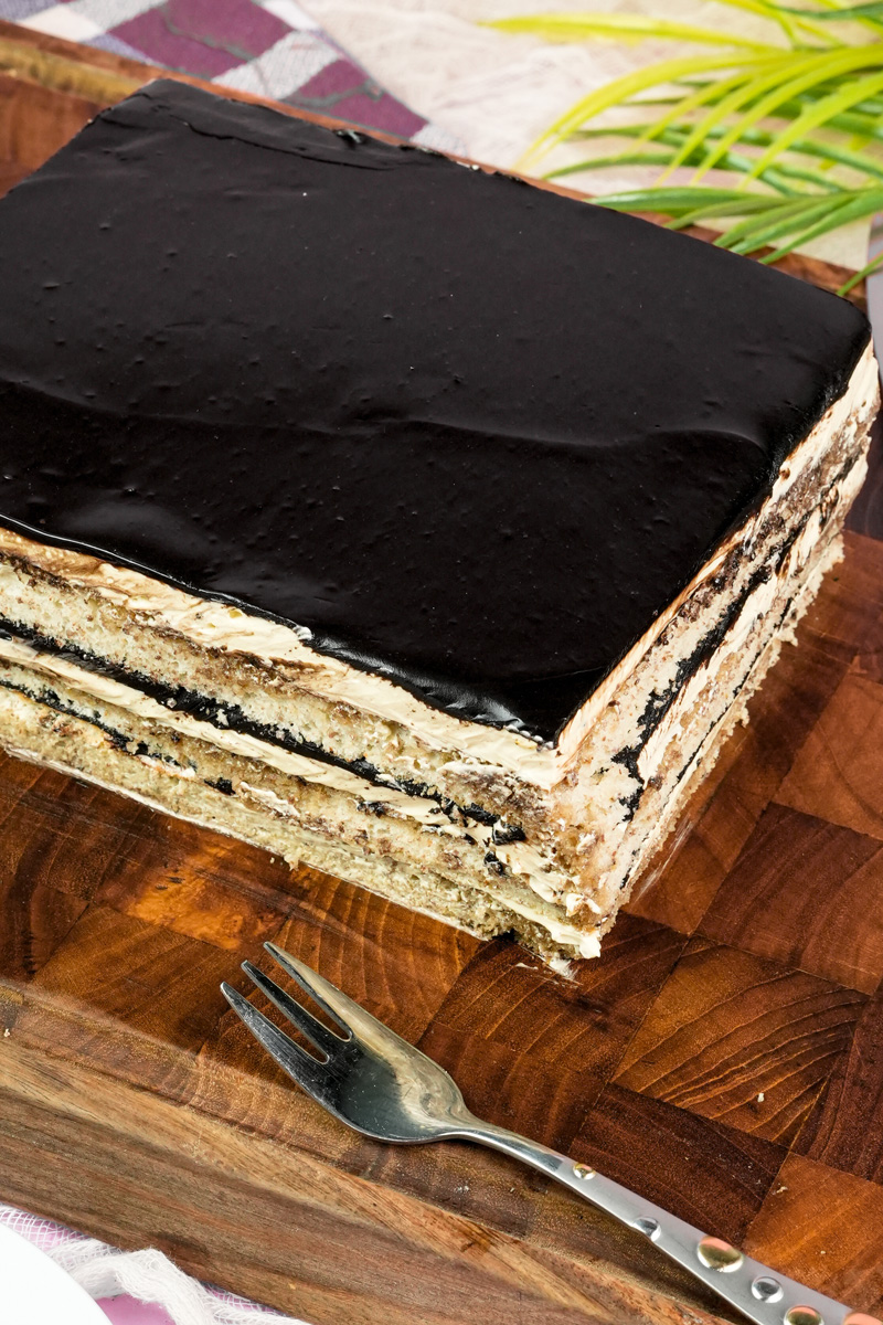 Complete opera cake with glossy chocolate glaze topping