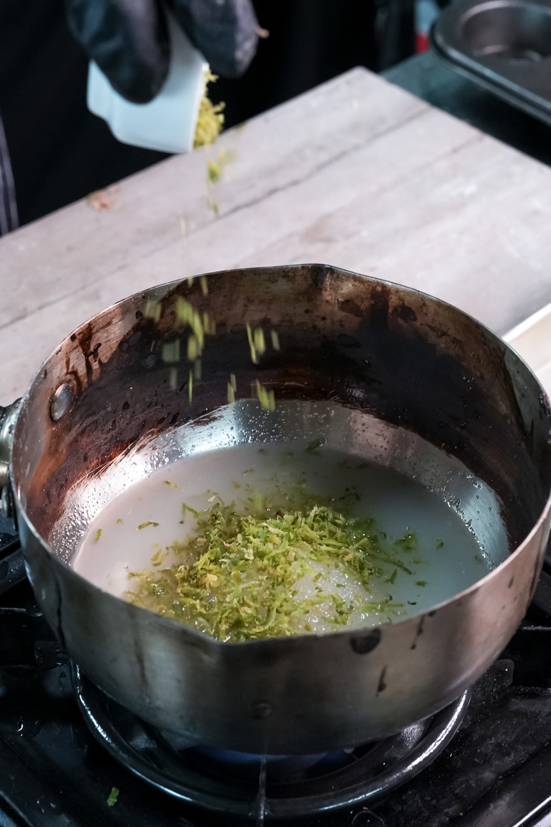 Cooking lemon zest in saucepan for homemade lemon curd recipe