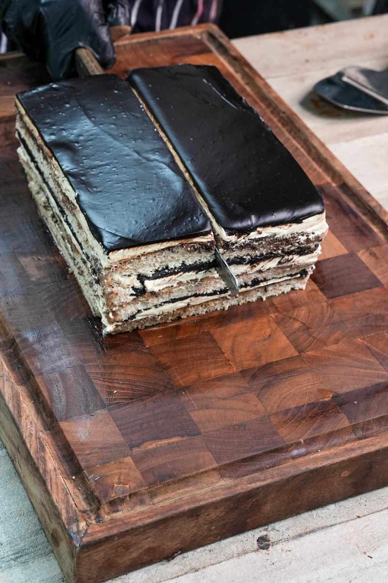 Cutting opera cake into individual serving portions