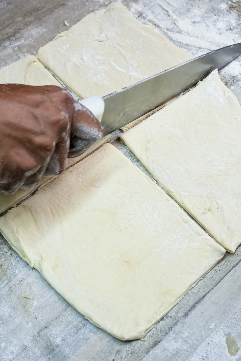 Cutting puff pastry into squares for apple turnovers