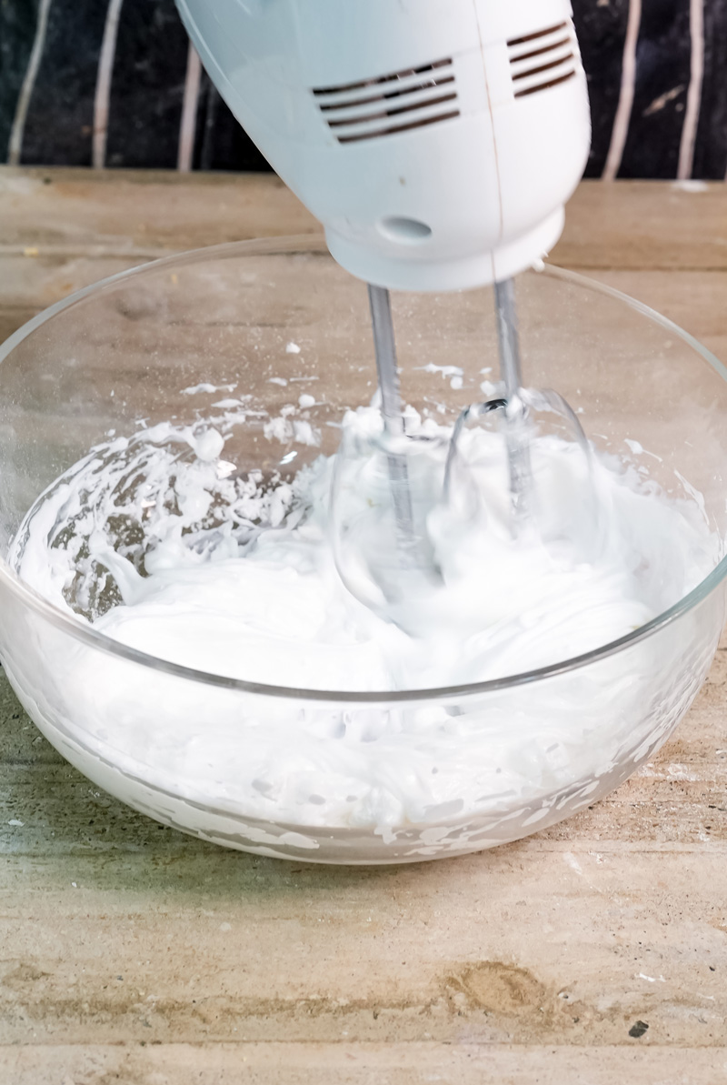Electric mixer whipping cream for charlotte cake filling