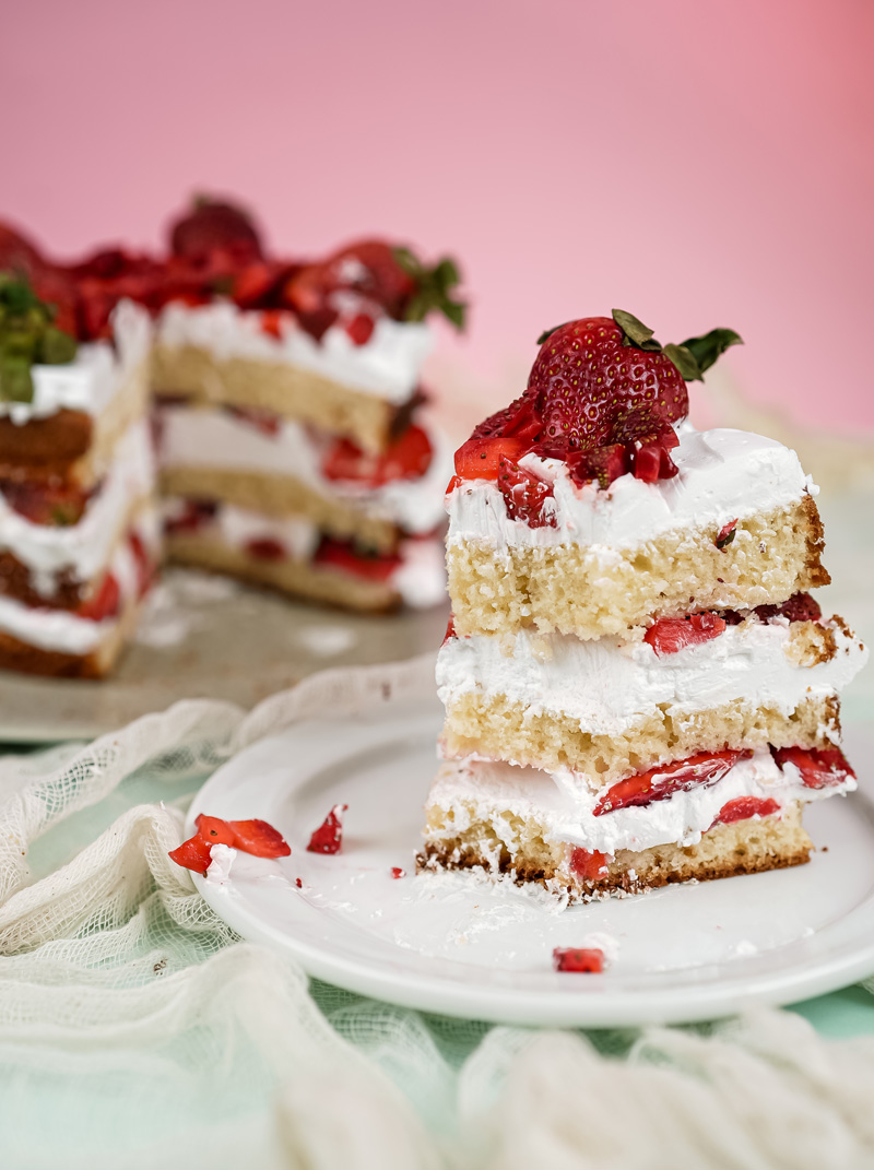 Elegant strawberry shortcake slice presentation with gold fork