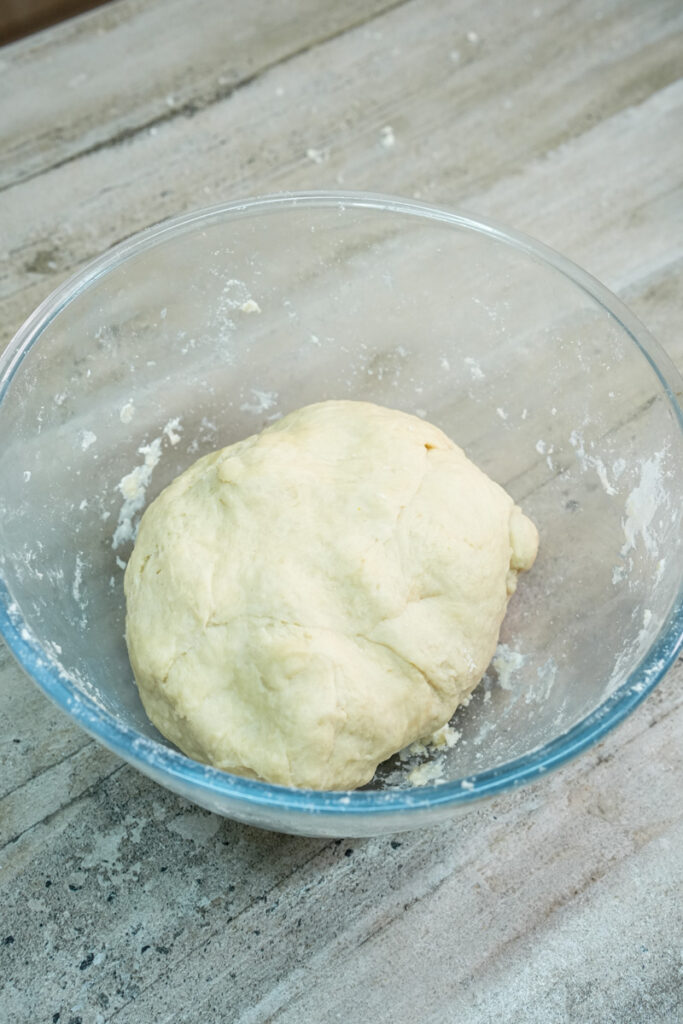 Empanada dough ball formed in mixing bowl