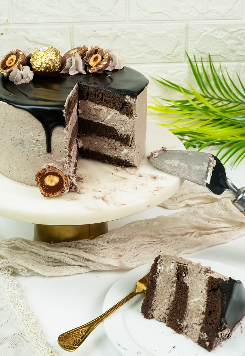 Ferrero Rocher cake sliced and ready to serve with cake server