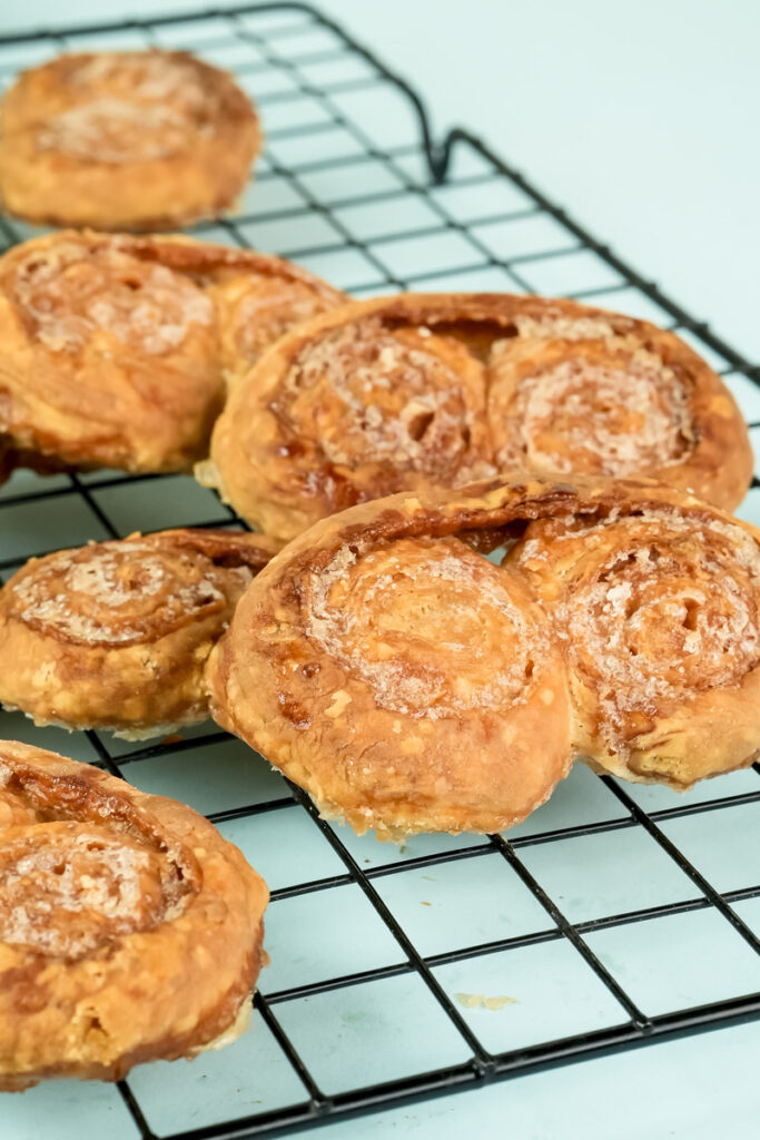 Final baked palmiers cooling on wire rack