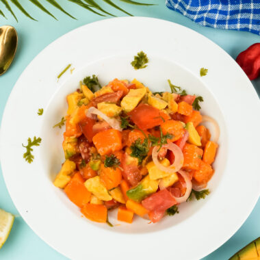 Finished mango avocado salad plated with tropical styling