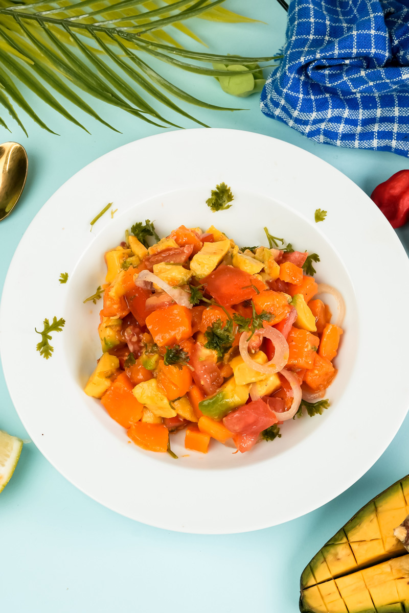Finished mango avocado salad plated with tropical styling