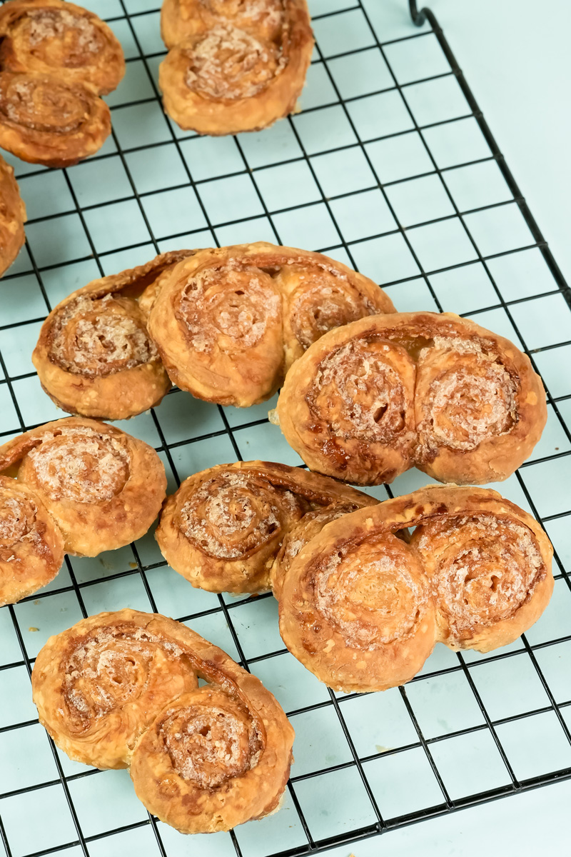 Finished palmiers on cooling rack after baking