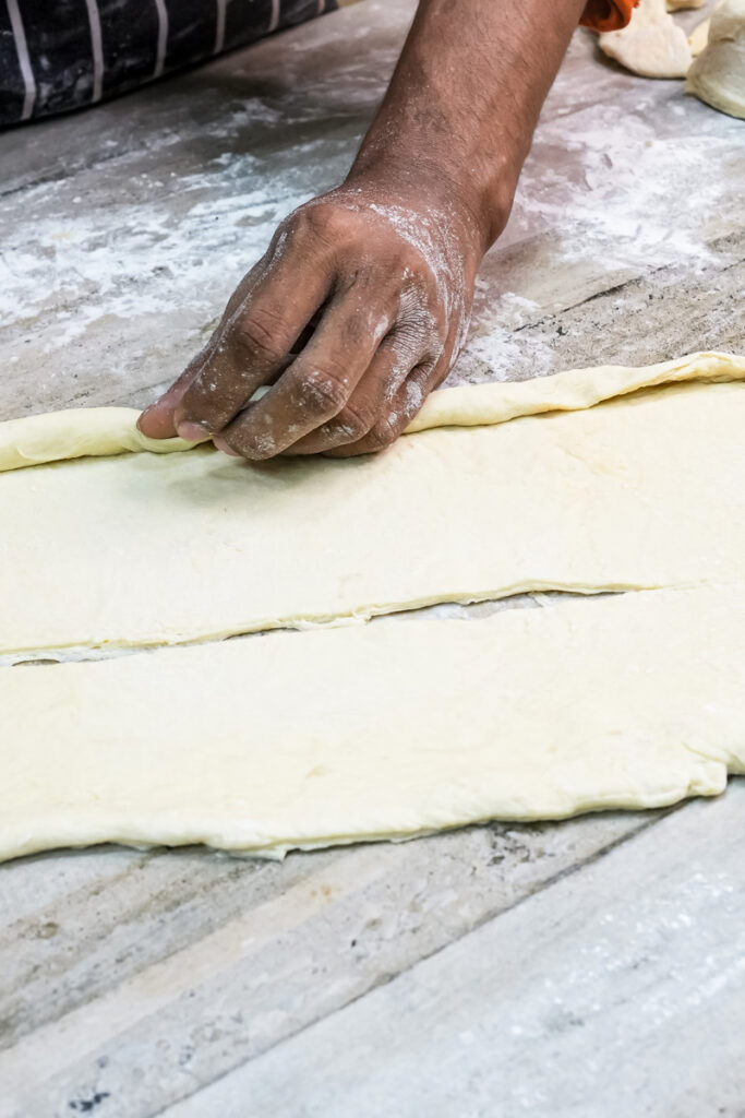 Folding laminated dough