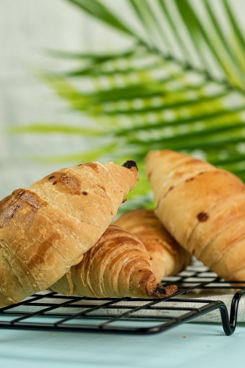Fresh baked croissant bread cooling after baking