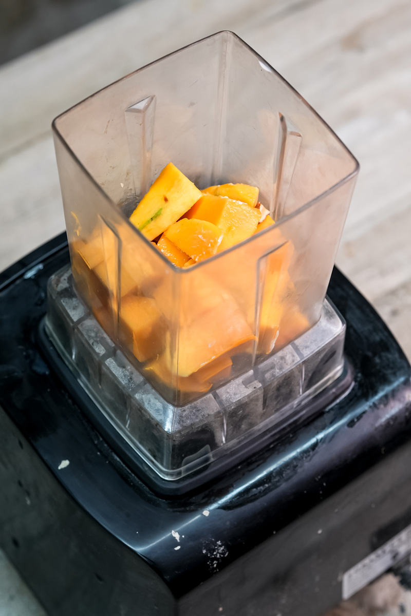 Fresh mango chunks in blender for mango sago recipe