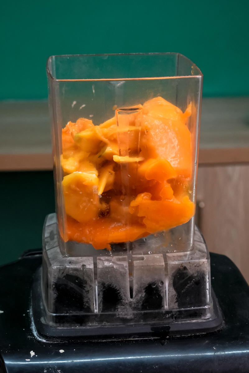 Fresh mango chunks in blender for mango lassi recipe