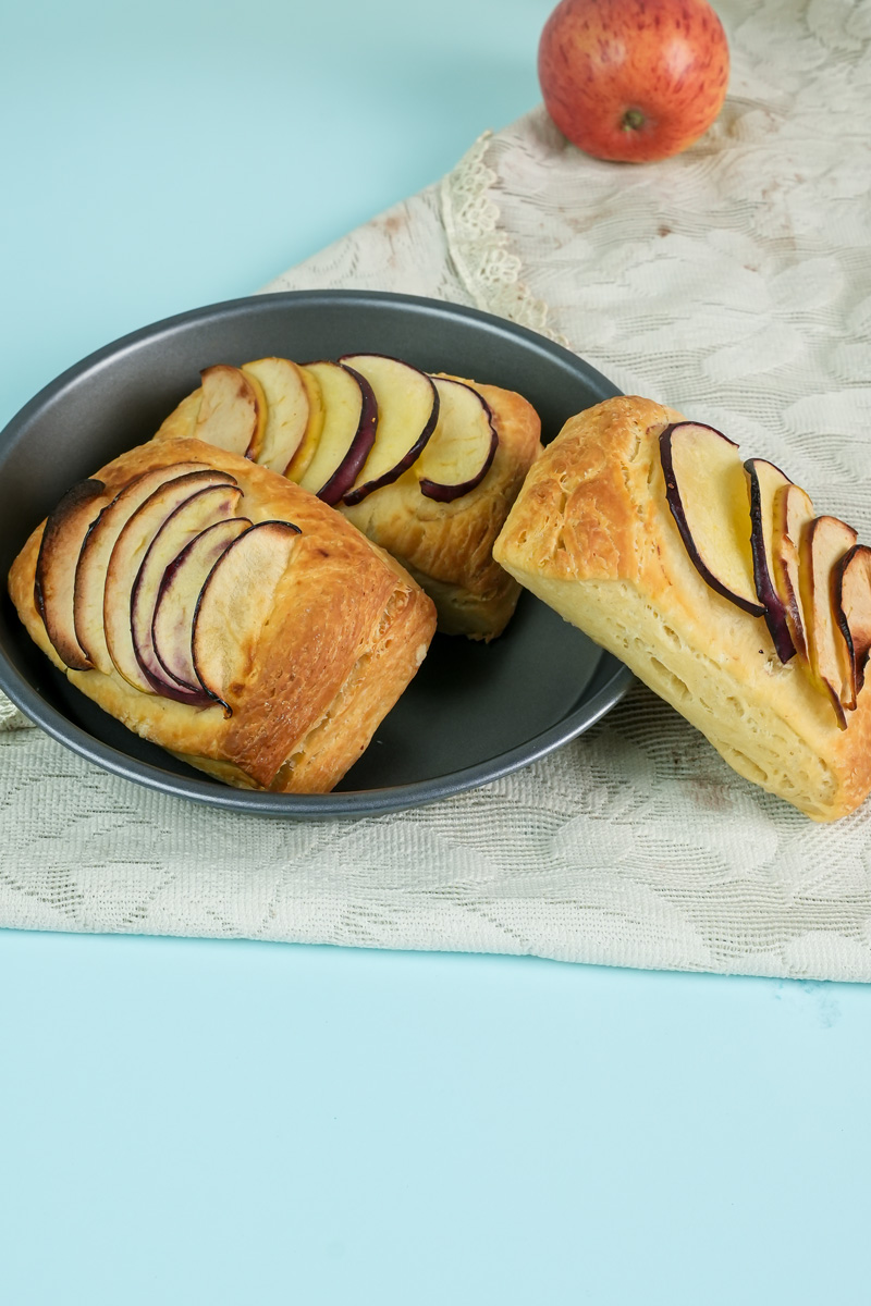 Golden baked apple Danish pastries in baking pan