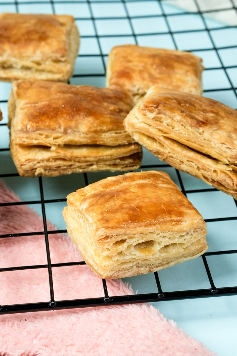 Golden baked homemade puff pastry on cooling rack